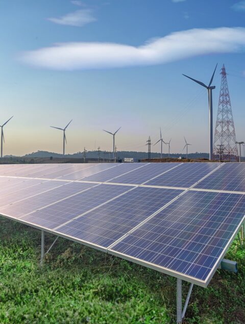 renewable-energy-solar-panels-wind-turbines-green-grass-blue-sky renewable-energy-solar-panels-wind-turbines-green-grass-blue-sky